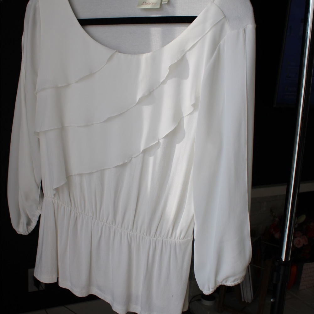 White ruffled blouse